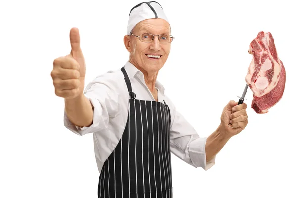 Mature butcher holding a knife — Stock Photo, Image