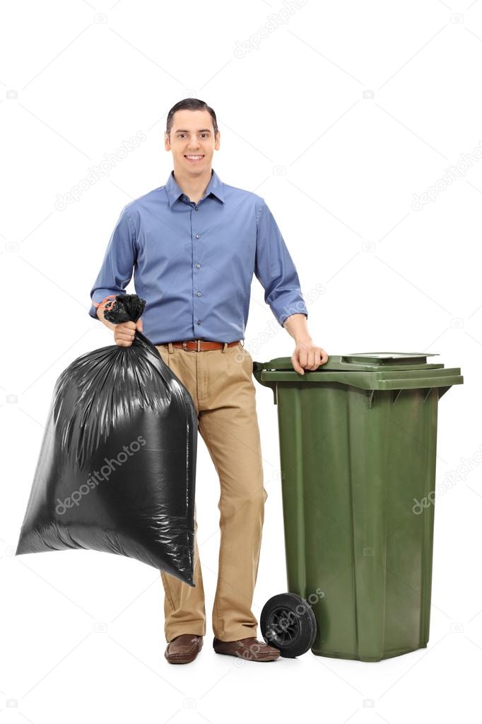 Guy holding a trash bag — Stock Photo © ljsphotography 122875402
