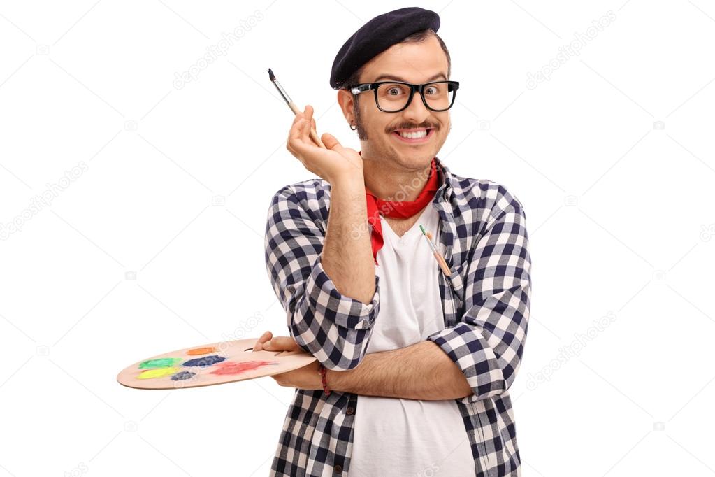 Painter holding a paintbrush and a color palette