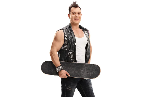 Punker holding a skateboard — Stock Photo, Image