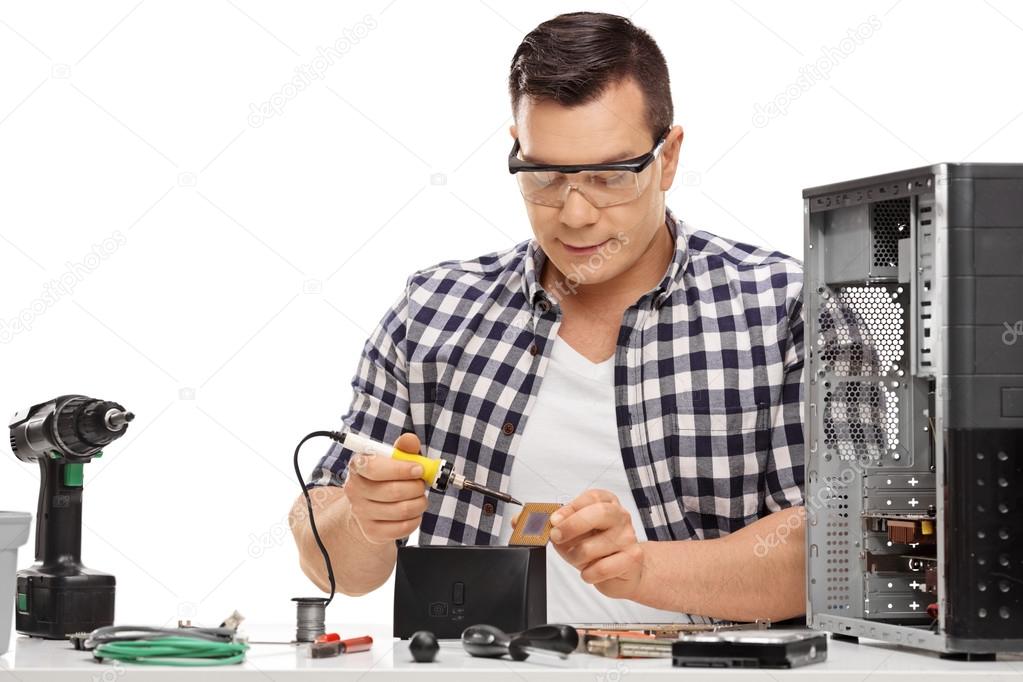 Computer technician repairing a computer