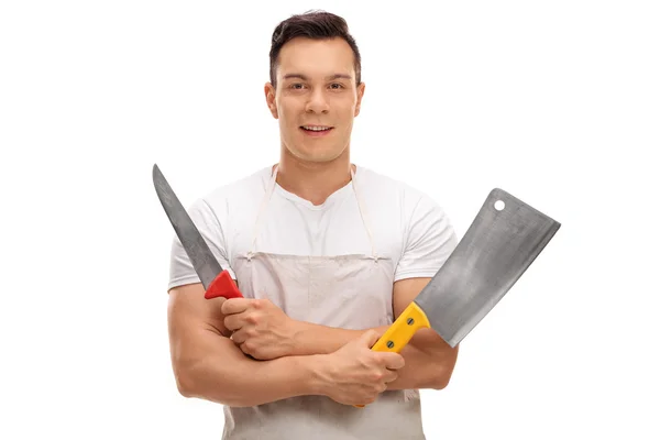 Carnicero sosteniendo una cuchilla y un cuchillo — Foto de Stock