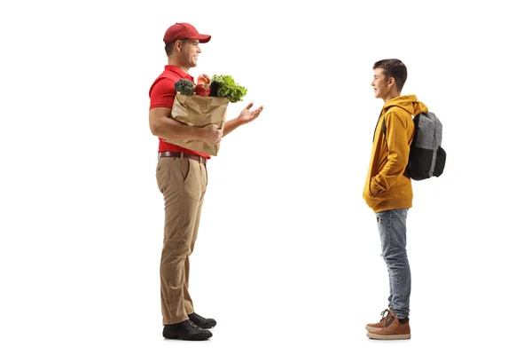 Full Length Profile Shot Delivery Man Holding Groceries Paper Bag — Stock Photo, Image