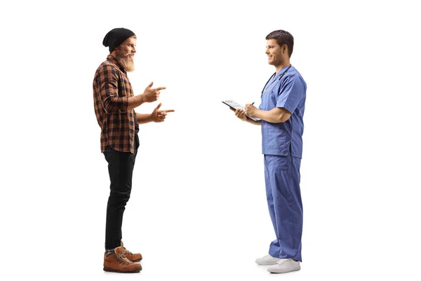 Full Length Profile Shot Bearded Young Man Standing Talking Doctor — Stock Photo, Image