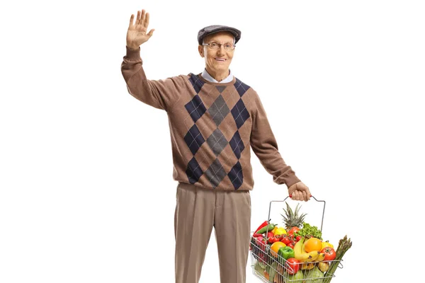 Elderly Man Carrying Full Shopping Basket Waving Camera Isolated White — Stock Photo, Image