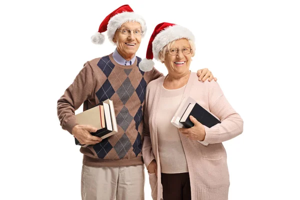 Elderly Couple Wearing Santa Claus Hats Holding Books Isolated White — Stock Photo, Image