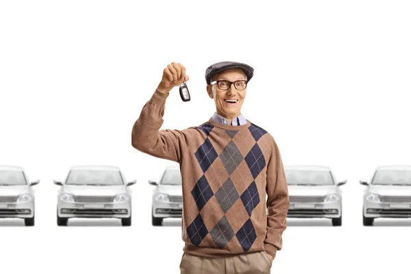 Elderly Man Car Showroom Showing Car Key Isolated White Background — Stock Photo, Image