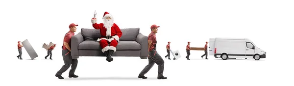 Movers Carregando Sofá Com Papai Noel Apontando Para Cima Outros — Fotografia de Stock