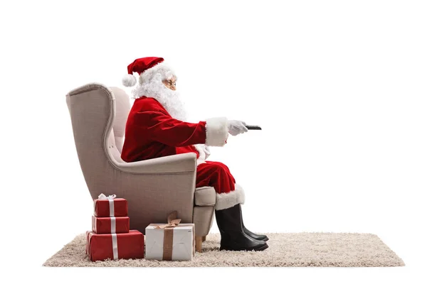 Santa Claus Sitting Armchair Holding Remote Control Isolated White Background — Stock Photo, Image