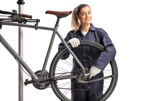 Female Bike Mechanic Repairing Bicycle Wrench Smiling Camera Isolated White — Stock Photo, Image