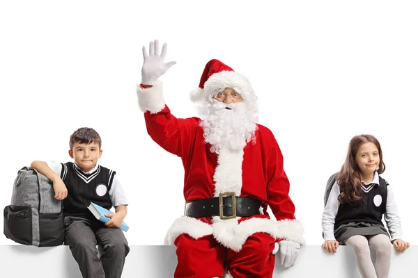 Papai Noel Acenando Sentado Painel Com Estudante Estudante Isolado Fundo — Fotografia de Stock