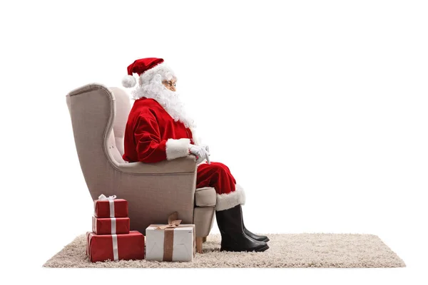 Profile Shot Santa Claus Sitting Armchair Presents Next Him Isolated — Stock Photo, Image