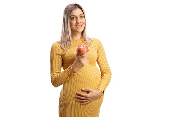 Lachende Zwangere Vrouw Een Gele Jurk Met Een Appel Geïsoleerd — Stockfoto