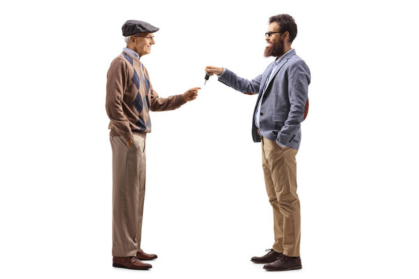 Bearded man giving car keys to an elderly man isolated on white background