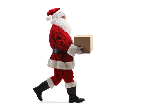 Plano Perfil Longitud Completa Santa Claus Llevando Una Caja Cartón — Foto de Stock