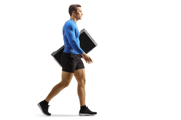 Full Length Profile Shot Fit Man Walking Carrying Aerobic Stepper — Stock Photo, Image