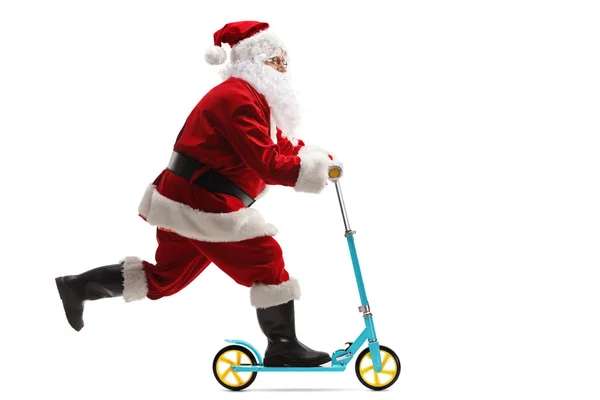 圣诞老人坐着一辆白色背景隔离的推动式摩托车的全长侧面照 — 图库照片
