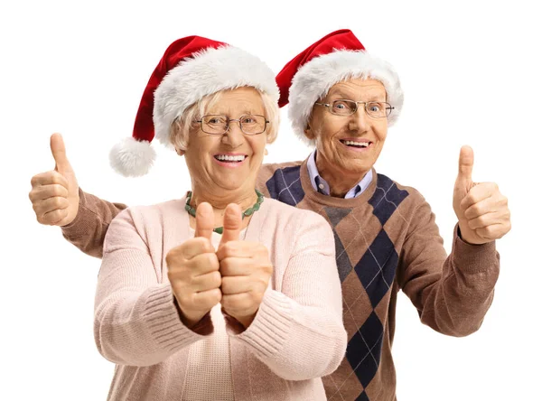 Felice Coppia Anziana Con Cappelli Babbo Natale Tenendo Pollici Alto — Foto Stock