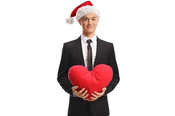 Joven Hombre Guapo Traje Sombrero Navidad Sosteniendo Corazón Rojo Aislado —  Fotos de Stock