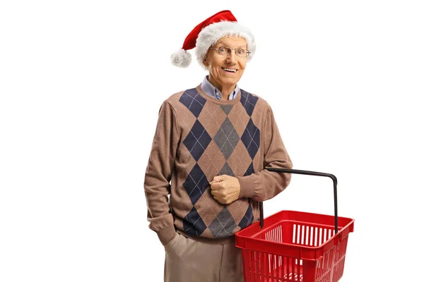 Oudere Man Met Een Boodschappenmandje Een Kerstmuts Geven Een Duim — Stockfoto