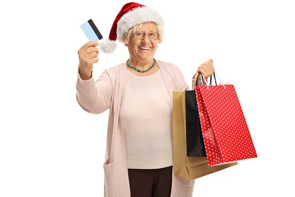 Kredi Kartı Noel Alışveriş Çantaları Olan Yaşlı Bir Kadın Beyaz — Stok fotoğraf