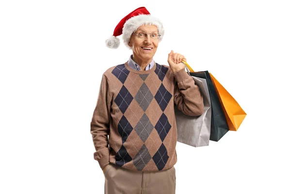 Älterer Herr Mit Weihnachtsmann Hut Und Einkaufstaschen Auf Weißem Hintergrund — Stockfoto