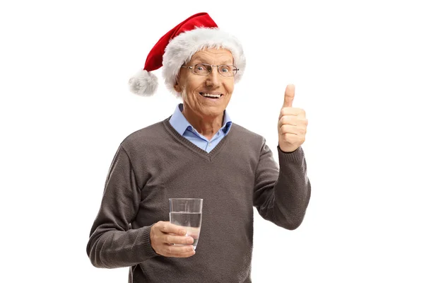 Homem Idoso Com Chapéu Papai Noel Segurando Copo Água Dando — Fotografia de Stock