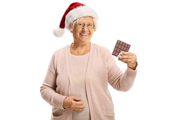 Äldre Kvinna Med Tomte Klo Hatt Håller Choklad Och Ler — Stockfoto