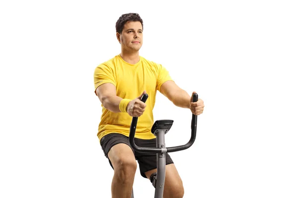 Young Man Riding Exercise Bike Isolated White Background — Stock Photo, Image