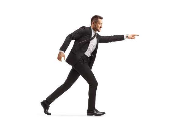 Businessman running and pointing forward isolated on white background