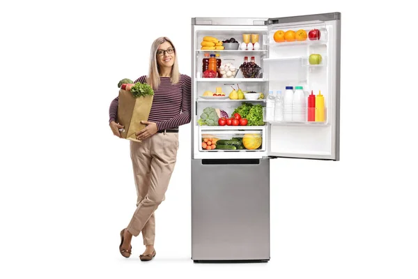 Young Woman Grocery Bag Leaning Fridge Healthy Food Isolated White — Stock Photo, Image