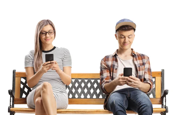 Jovem Cara Sentado Banco Com Telefones Celulares Isolados Fundo Branco — Fotografia de Stock