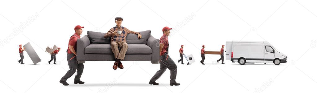 Movers moving a couch with a pensioner sitting with a cup of tea and smiling isolated on white background