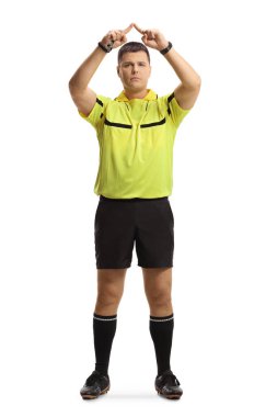 Full length portrait of football referee gesturing a VAR symbol isolated on white background clipart