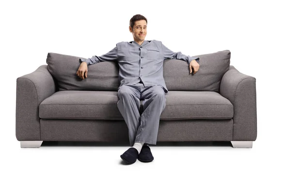 Fröhlicher Junger Mann Hause Pyjama Auf Einem Sofa Auf Weißem — Stockfoto