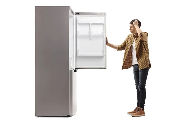 Young Man Panic Looking Empty Fridge Isolated White Background — Stock Photo, Image