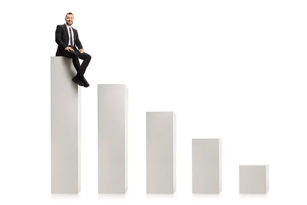 Businessman Sitting Highest Column Chart Isolated White Background — Stock Photo, Image