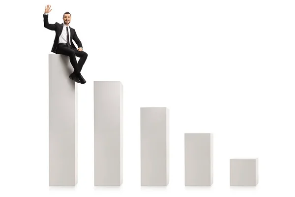 Businessman Sitting Highest Column Bar Chart Waving Isolated White Background — Stock Photo, Image