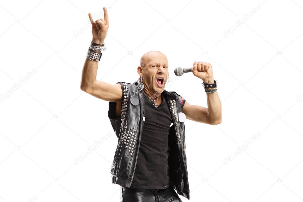 Male rock singer with a microphone gesturing a sign isolated on white background