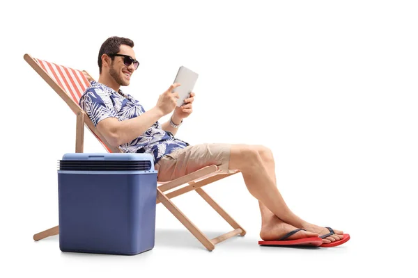 Young Man Sitting Deck Chair Next Cooling Box Holding Digital — Stock Photo, Image