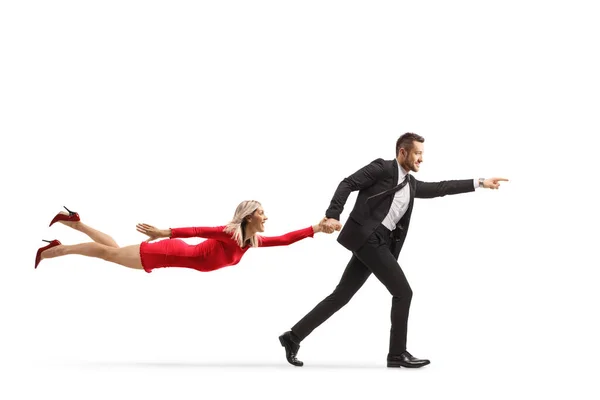 Man Suit Running Pulling Woman Red Dress Isolated White Background — Stock Photo, Image