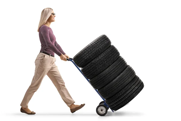 Full Length Profile Shot Young Woman Pushing Hand Truck Loaded — Zdjęcie stockowe