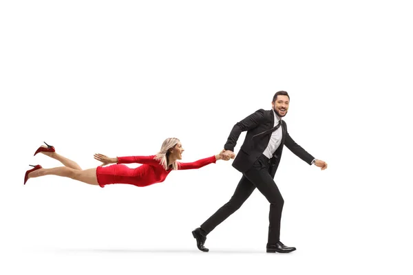 Man Suit Tie Running Pulling Flying Woman Red Dress Isolated — Stock Photo, Image