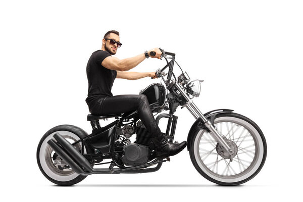 Man with sunglasses riding a chopper motorbike isolated on white background