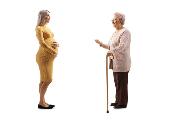 Full Length Profile Shot Pregnant Woman Talking Grandmother Isolated White — Stock Photo, Image