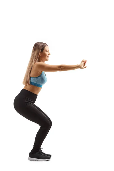 Full Length Profile Shot Young Woman Sportswear Exercising Squats Isolated — Stock Photo, Image