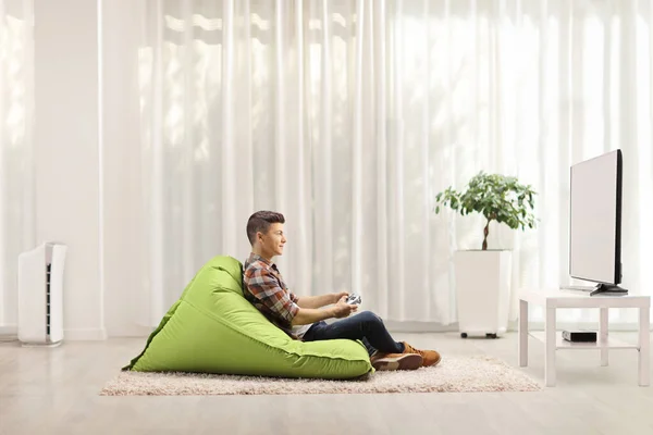 Profile Shot Male Teenager Sitting Bean Bag Armchair Playing Video — Stock Photo, Image