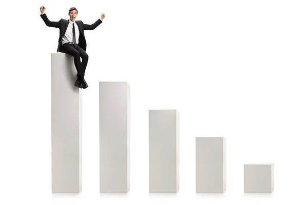 Businessman Gesturing Win Sitting Highest Column Chart Graph Isolated White — Stock Photo, Image