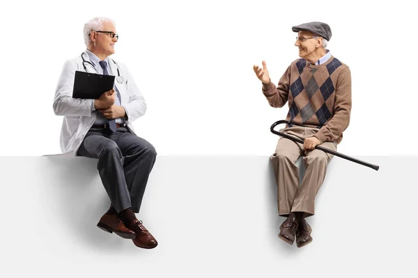 Full Length Shot Mature Doctor Sitting Blank Panel Listening Elderly — Stock Photo, Image