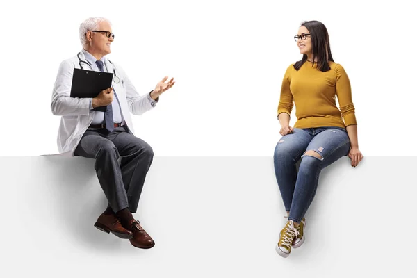 Full Length Shot Mature Doctor Sitting Blank Panel Talking Young — Stock Photo, Image